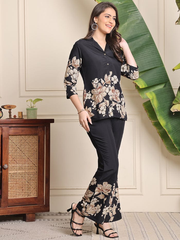 Black floral co-ord set with three-quarter sleeve blouse and matching flared pants