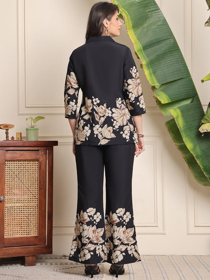 Black floral co-ord set, button-back blouse and wide-leg trousers with print