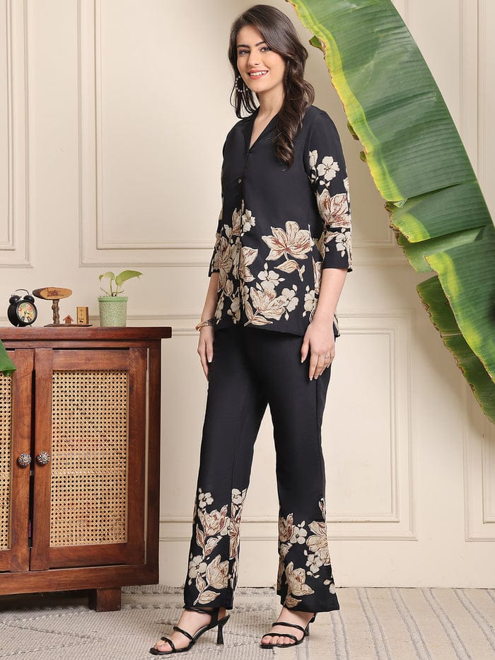 Black floral blouse and wide-leg trousers co-ord set with floral hem detailing