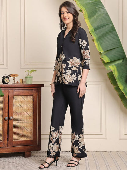 Black floral blouse and wide-leg trousers co-ord set with floral hem detailing