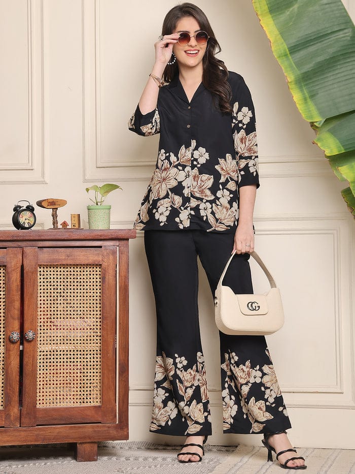 Black floral co-ord set with V-neck blouse and wide-leg trousers, floral border print