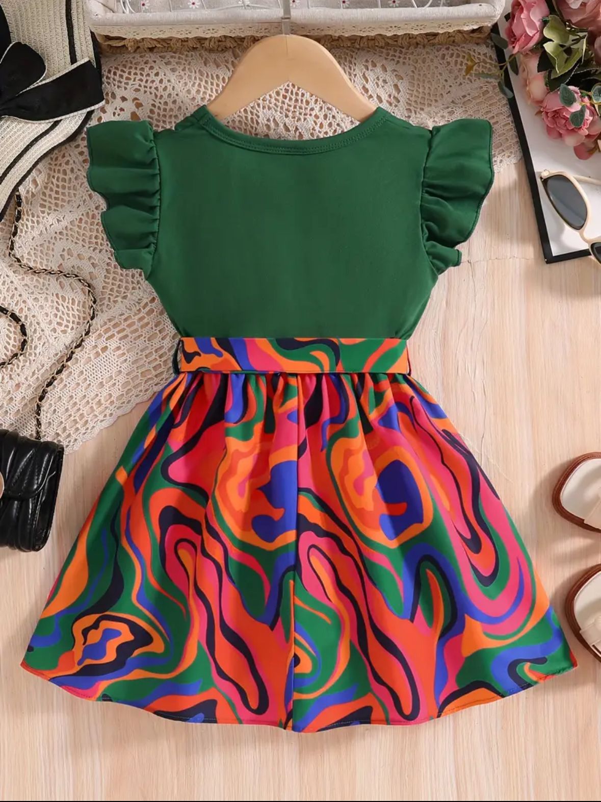 Multicolor belted frock dress with green short sleeves and swirl-pattern skirt