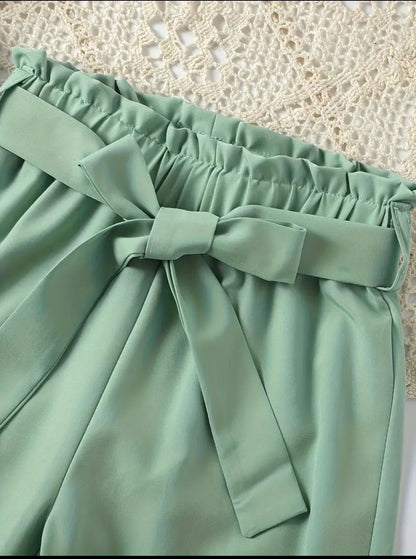 Mint-green pants with elastic waistband and tied bow detail