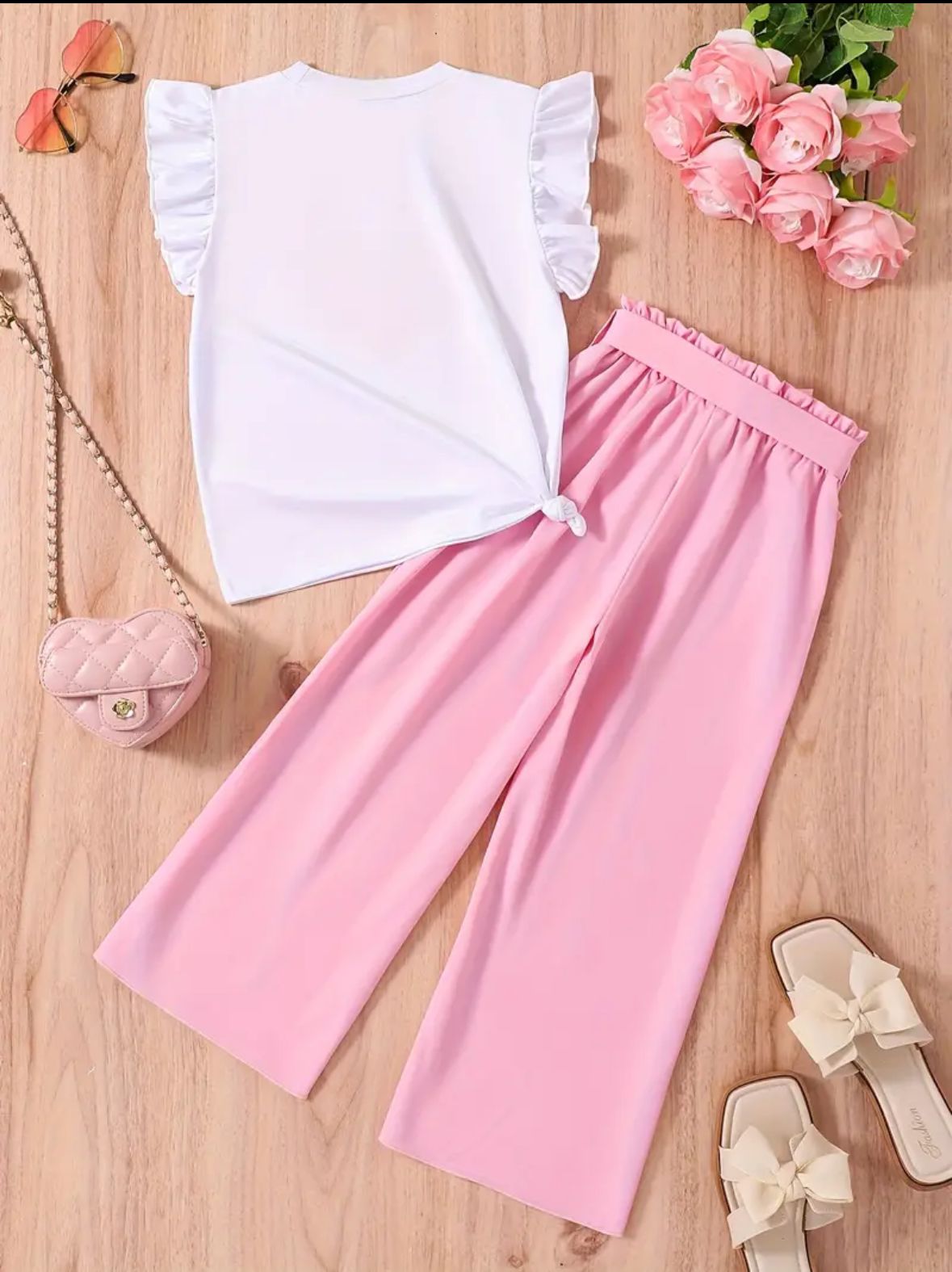 White ruffle-sleeve top with pink heart print and pink wide-leg pants