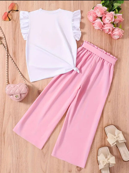 White ruffle-sleeve top with pink heart print and pink wide-leg pants