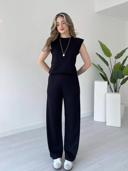 Solid black sleeveless co-ord set with crew neck top and wide-leg trousers