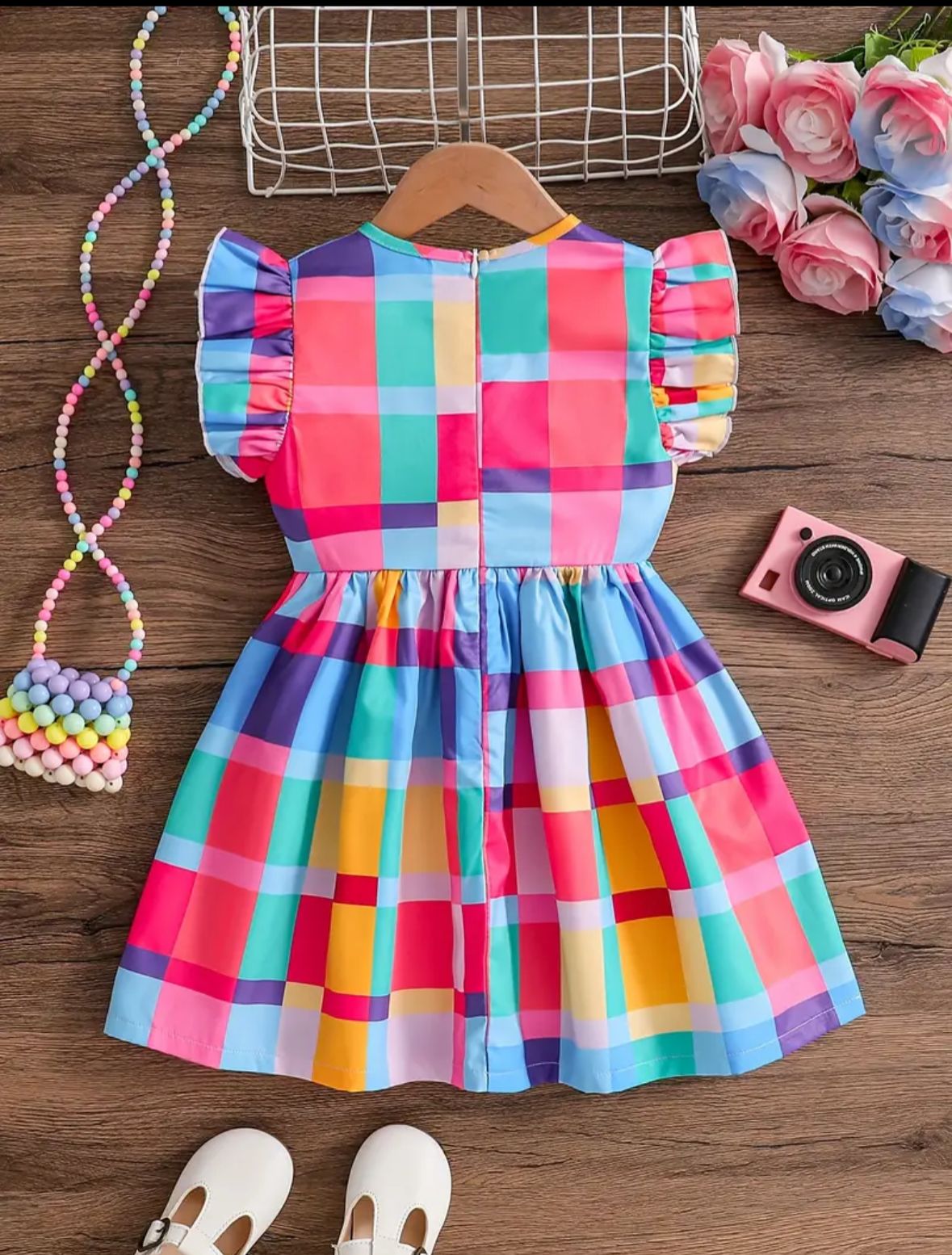Colorful plaid girls dress with ruffled cap sleeves and gathered bodice bow