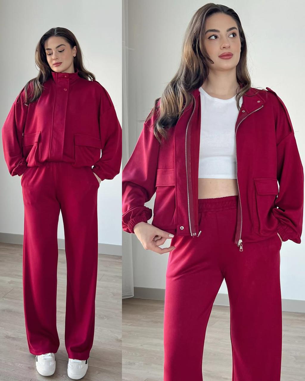 Maroon zip-up tracksuit jacket and jogger pants set with elastic cuffs and zip pockets