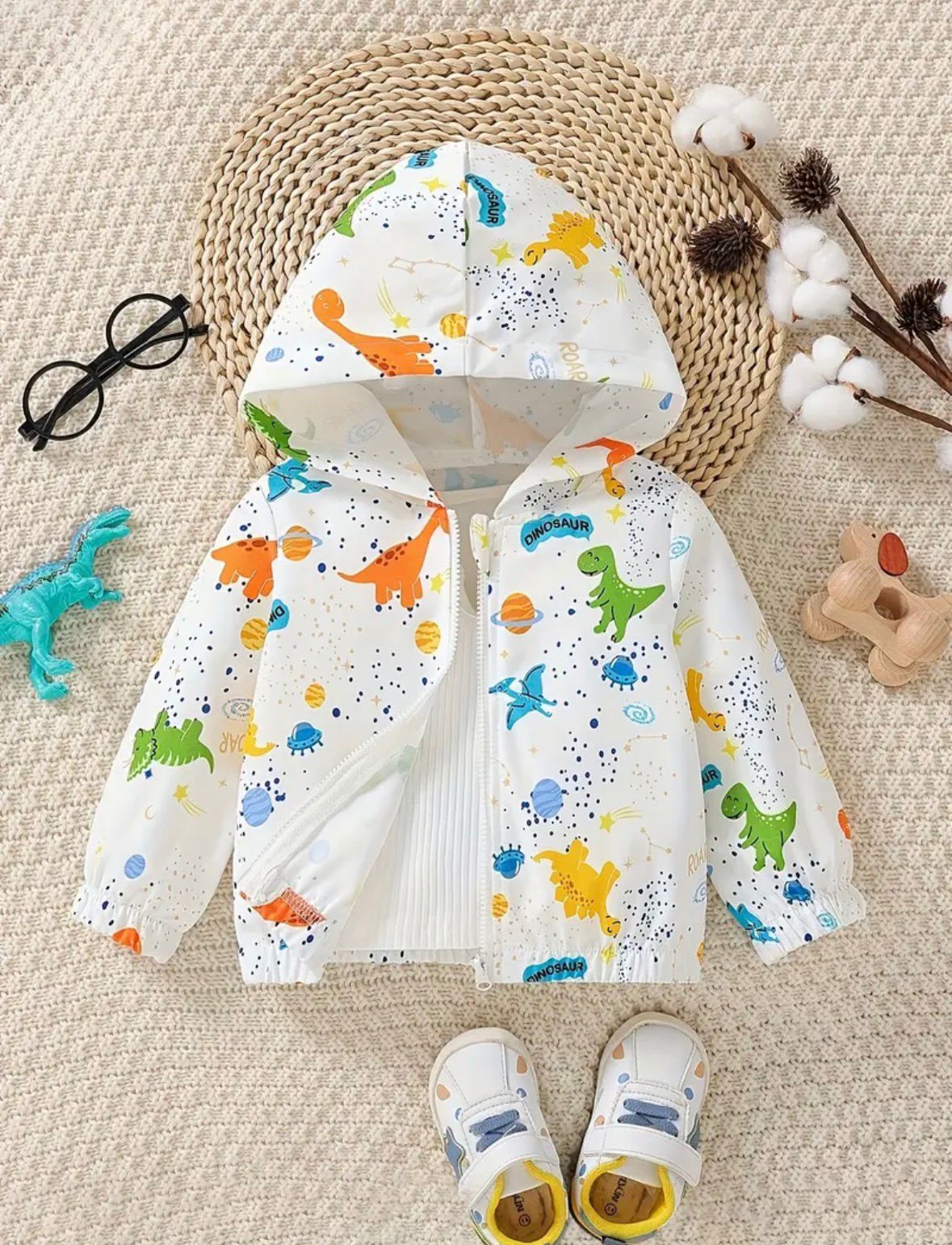 Baby hooded zip-up jacket with colorful dinosaur print and front zipper