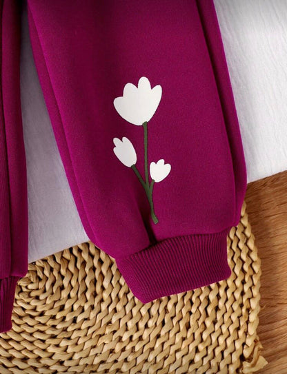 Burgundy trousers with white heart flower appliqué