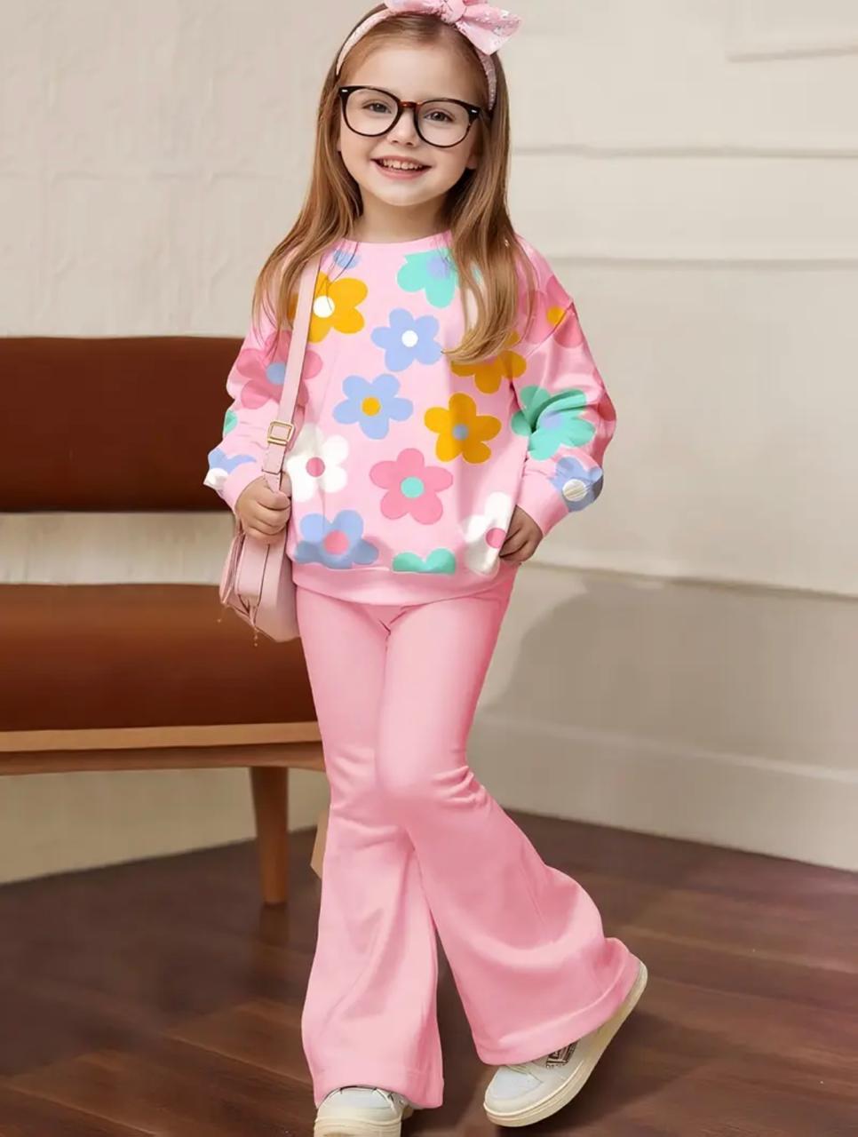 Girls' pink sweatshirt and flared trouser set with floral print, worn by a child