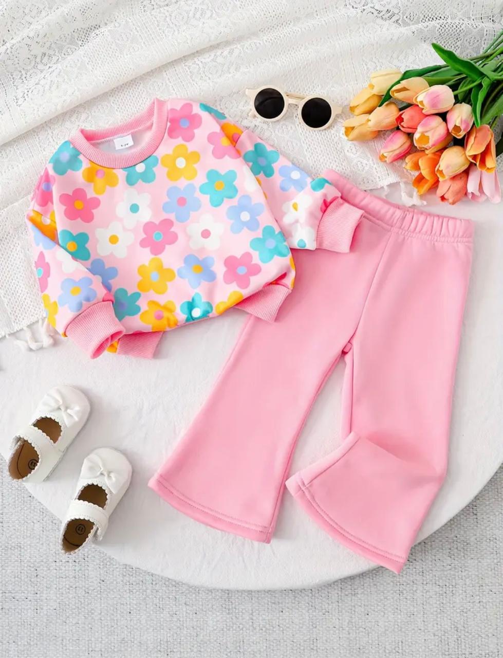 Girls' floral sweatshirt with pink trousers, bow cuffs and elastic waist, flat lay