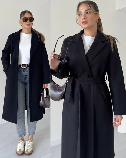 Black belted long coat with notched lapels and tie waist