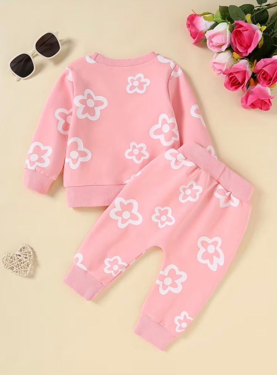 Pink long-sleeve top and pants set with white flower applique pattern