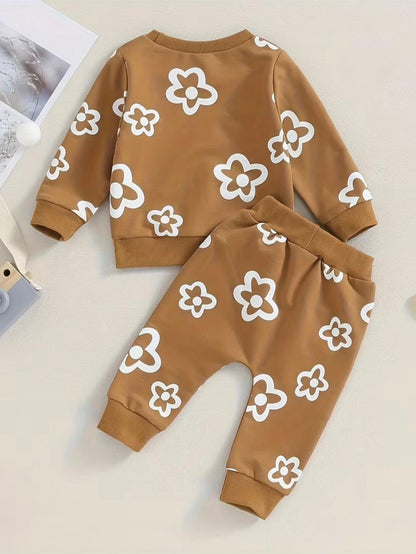 Brown two-piece set with white flower print long-sleeve top and cuffed pants