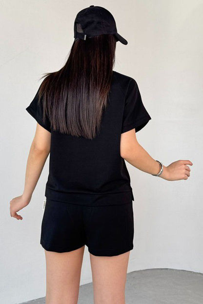 Black crewneck short-sleeve top and drawstring shorts set, back view