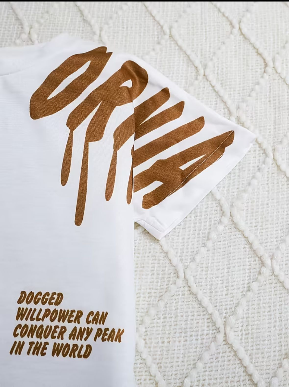 White T-shirt with brown drip-style graphic letters and small slogan text