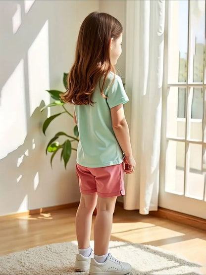 Kids rainbow graphic T-shirt and pink elastic-waist shorts set, back view