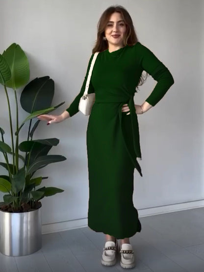 Bottle green modal tie dress with long sleeves, fitted midi silhouette, and waist tie