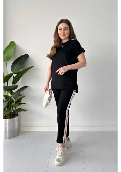2-piece Turkish panel co-ord set in black: short-sleeve top and slim pants with side stripe.