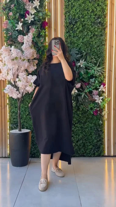 Loose dark tunic top with short sleeves and round neckline