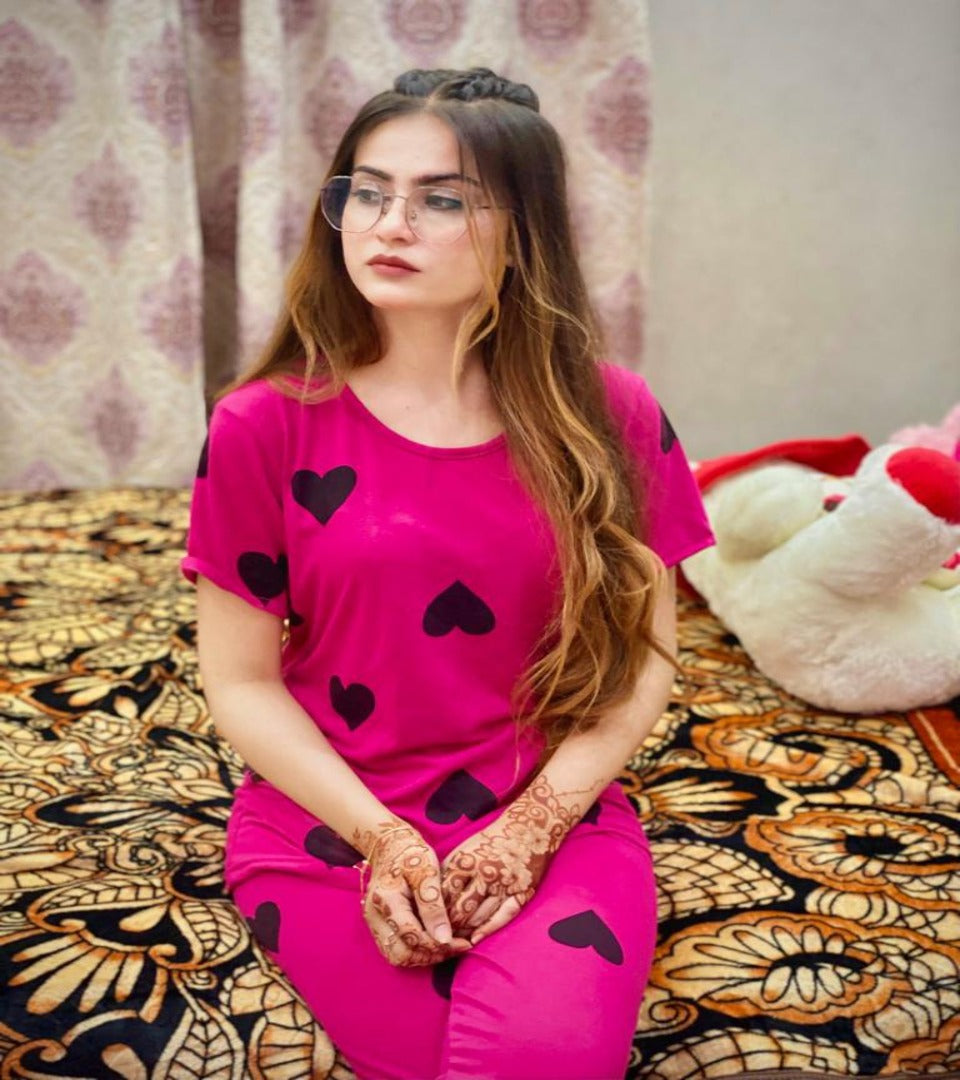 Pink PJ nightsuit set with black hearts; short-sleeve top and shorts